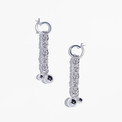 Leslie Earrings in solid 925 sterling silver with handwoven Byzantine chainmail and high-polish silver spheres on a white background