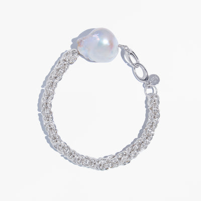 Crescent Bracelet featuring a baroque freshwater pearl and handwoven Byzantine chainmail in solid 925 sterling silver on a white background